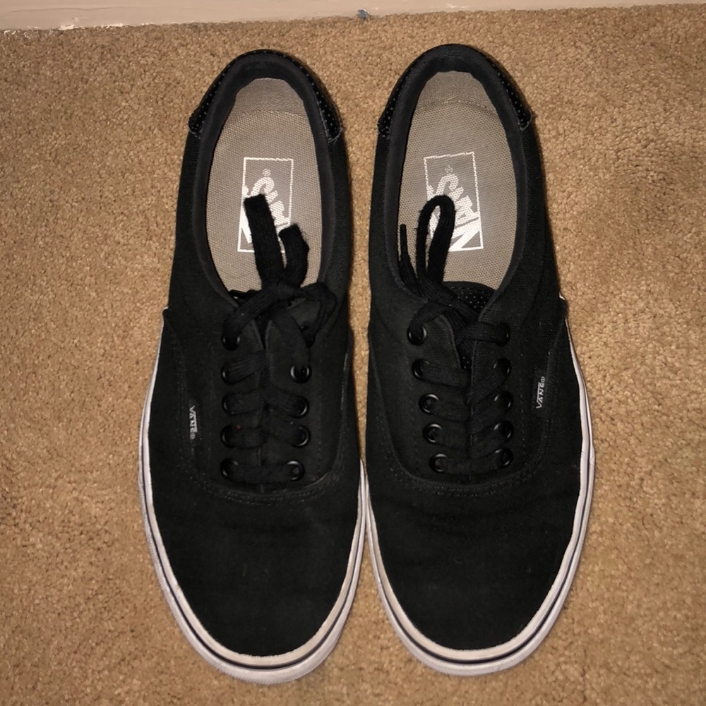black vans with a white base
